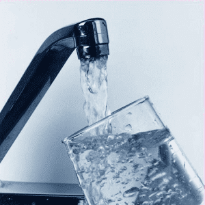 Faucet Pouring Water Into Glass